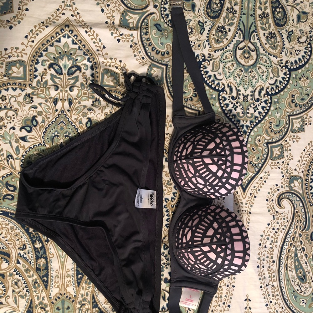 Bathing suite. Top is size small. Bottoms a medium